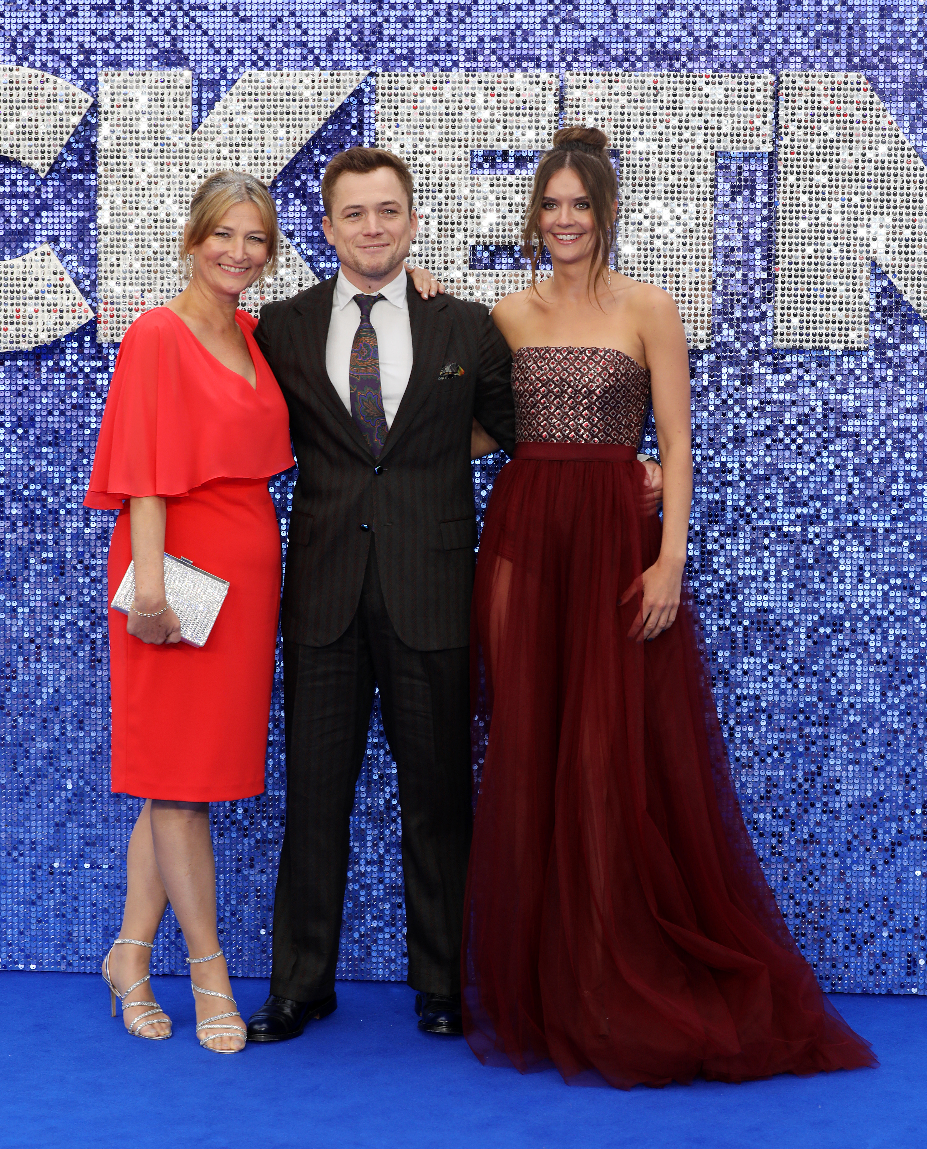 Actor Taron Egerton with mother Christine Egerton and partner Emily Thomas at the "Rocketman" UK premiere