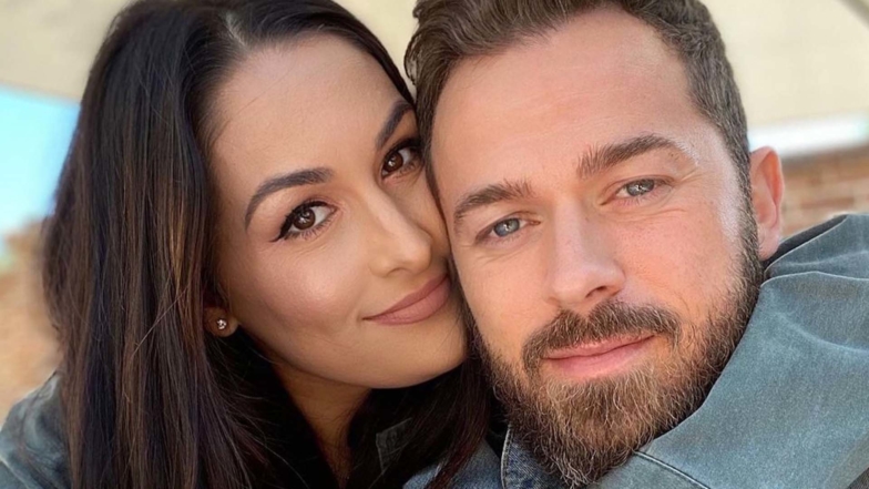 Nikki Garcia & Artem Chigvintsev Share Behind-The-Scenes Wedding Video In 1-Year Anniversary Tributes