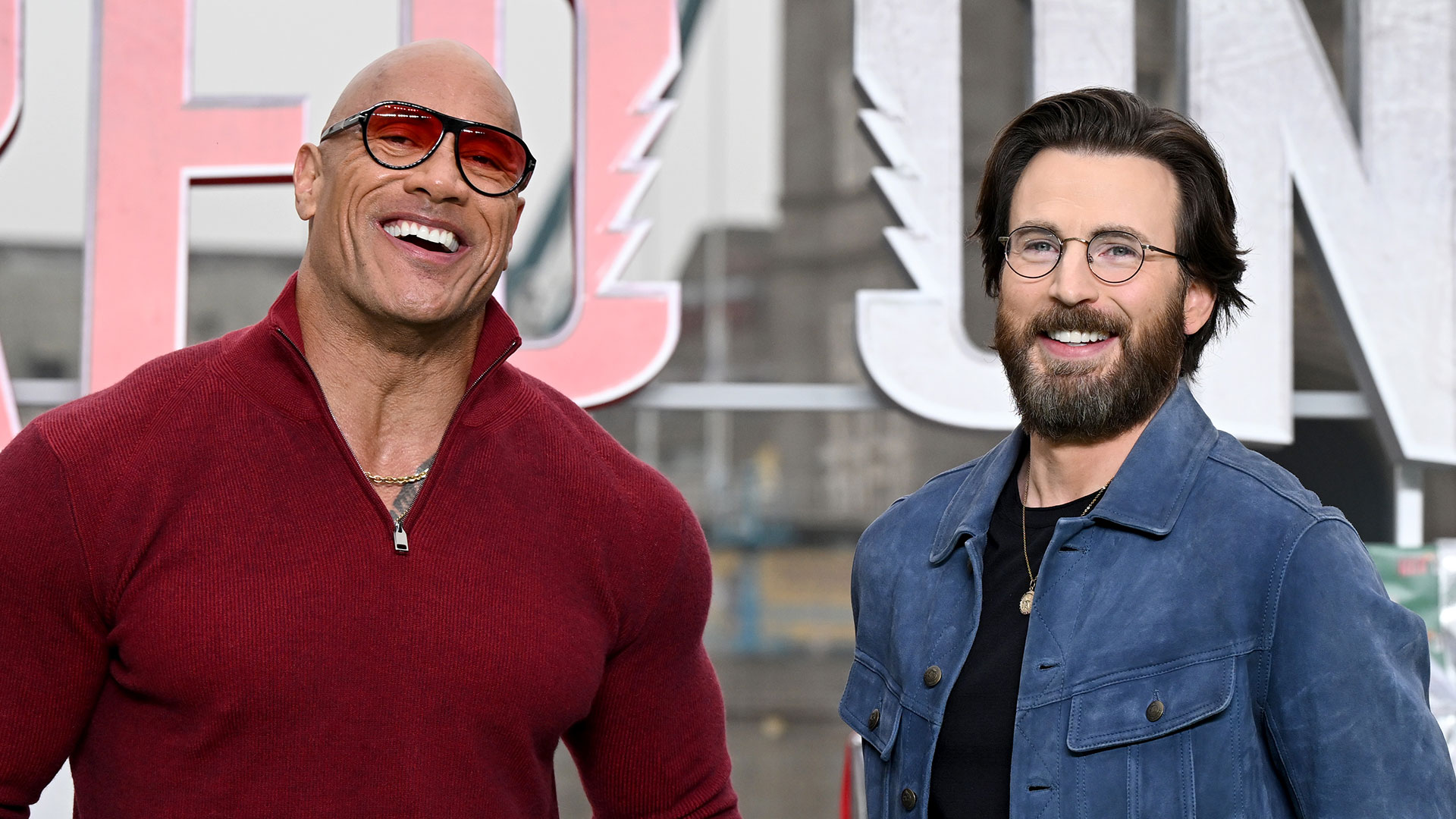 Dwayne Johnson aka The Rock and Chris Evans attend the "Red One" photocall at Potters Field Park on November 06, 2024 in London, England. (Photo by Jeff Spicer/Getty Images for Warner Bros. Pictures )